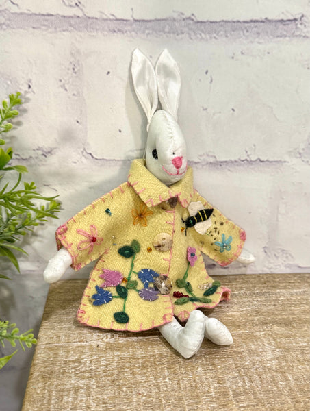 White bunny in yellow coat