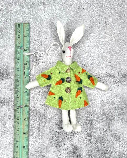 White bunny with green carrot coat