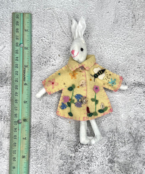 White bunny in yellow coat