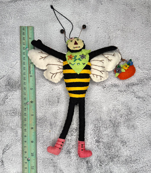 Primitive bee with flower basket