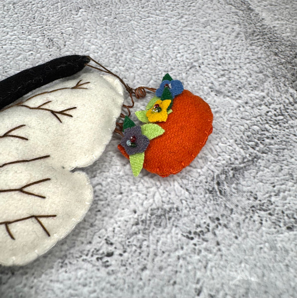 Primitive bee with flower basket