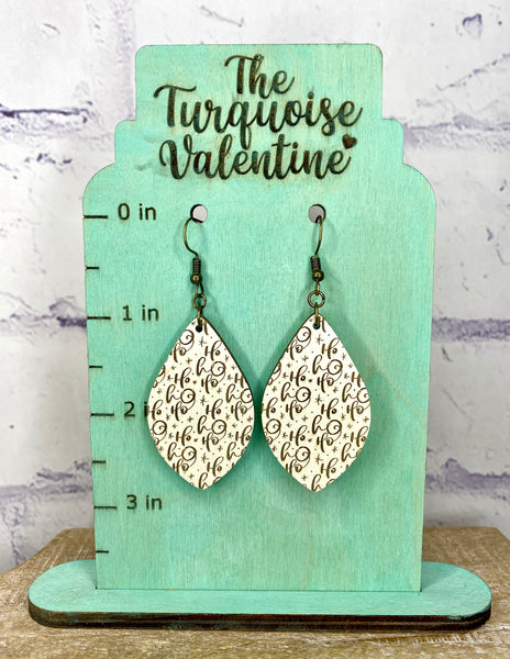 Cream colored wood Ho Ho Ho earrings