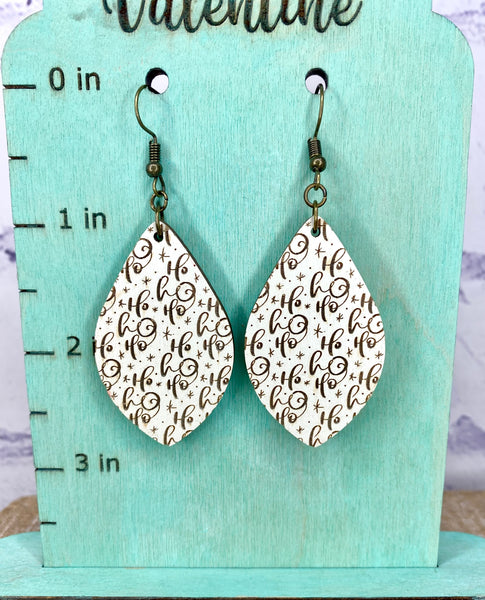 Cream colored wood Ho Ho Ho earrings