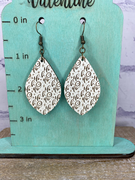 Cream colored wood Ho Ho Ho earrings