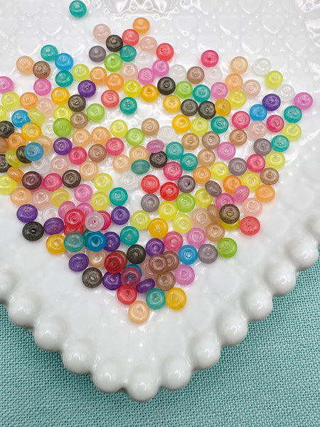 Clear, colored 6mm donut glass beads