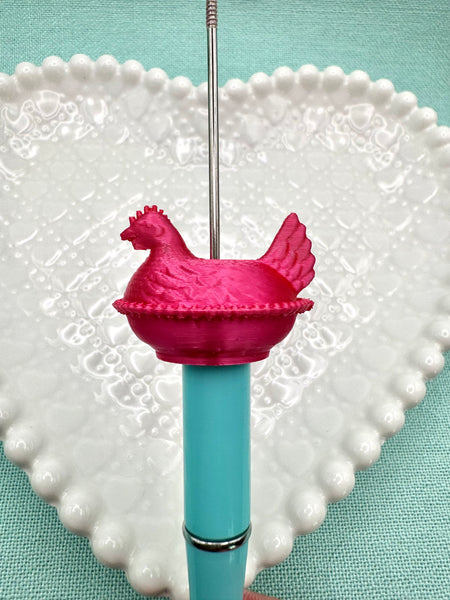 Pinkish red hen on nest bead
