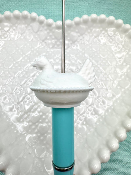 White hen on nest bead