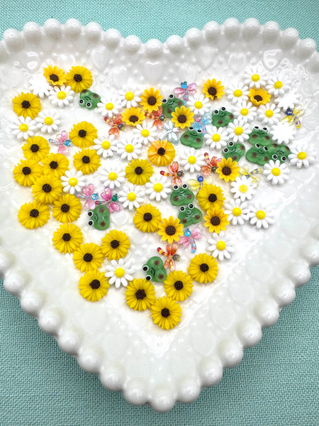 Mix of tiny flowers, frogs and dragonfly flatbacks