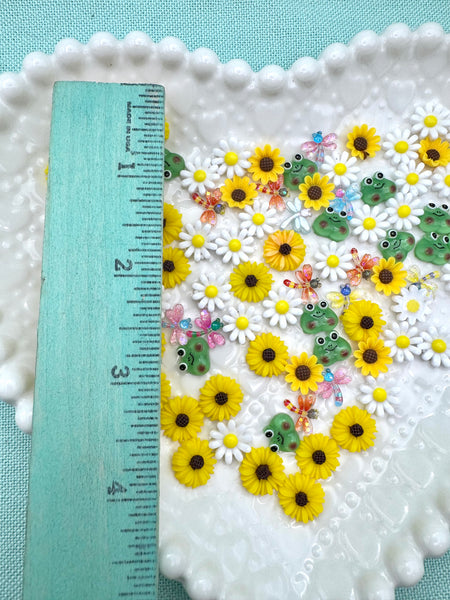 Mix of tiny flowers, frogs and dragonfly flatbacks