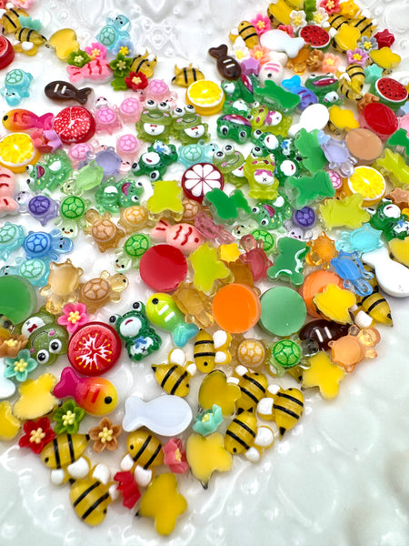 Mix of tiny bees, flowers, fish, fruit, frogs and turtles flatbacks