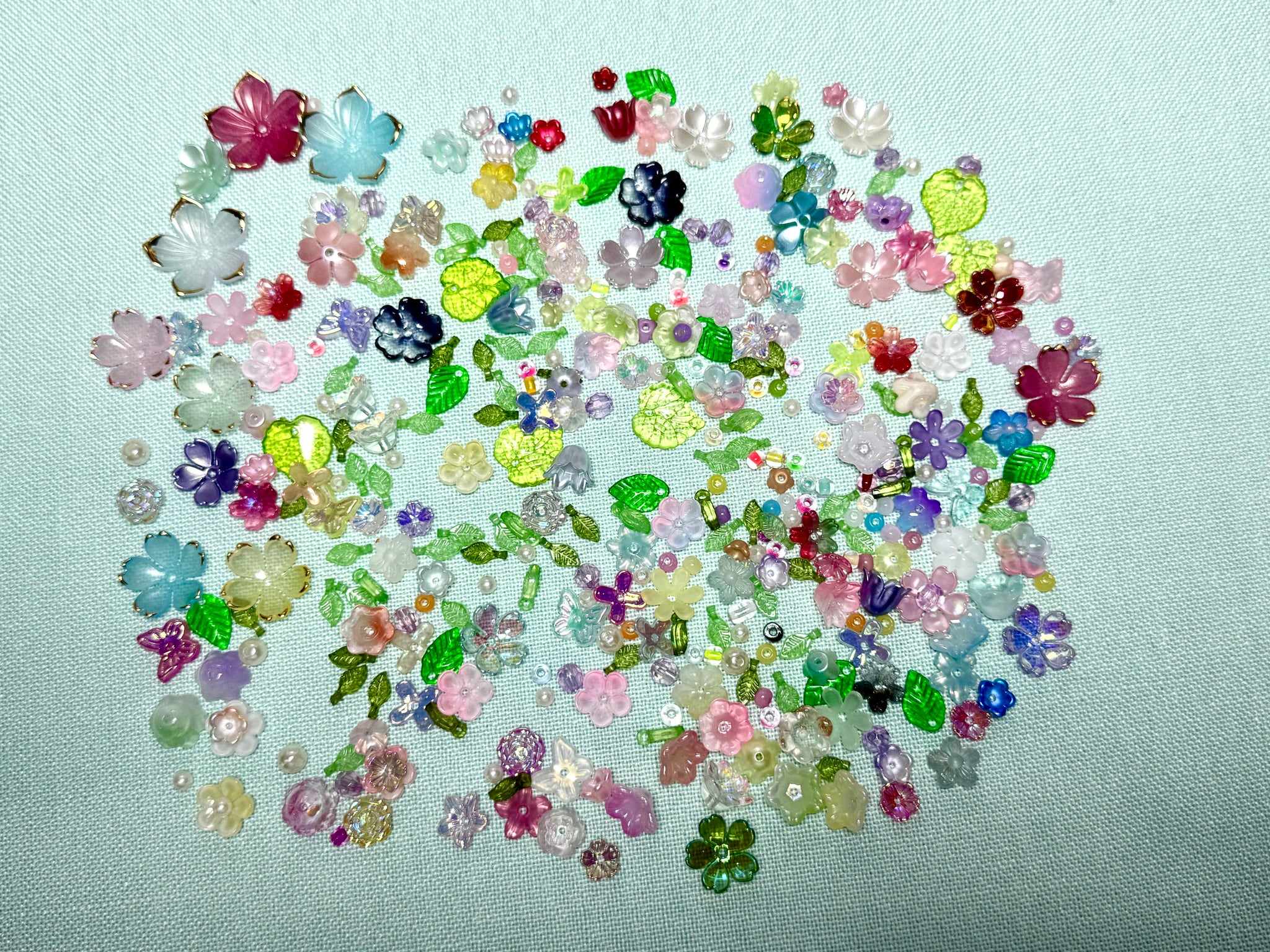 Flower beads and green seed beads for making flowers