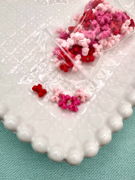 Red, hot pink and light pink tiny bow beads
