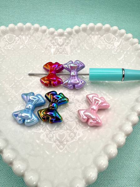 Colored bow beads (5)