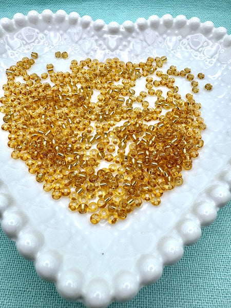 Gold lined 4mm glass seed beads