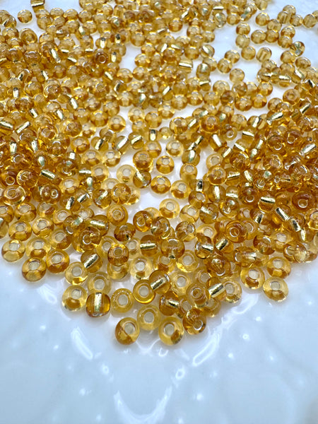 Gold lined 4mm glass seed beads
