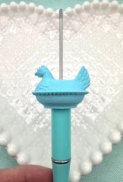 Light blue hen on nest bead