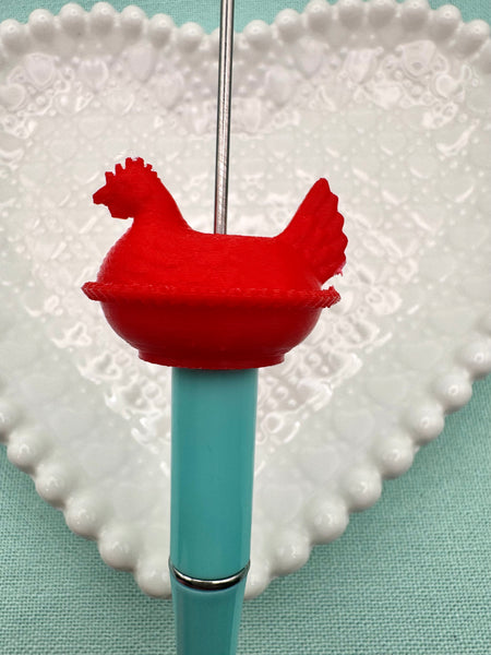 Red hen on nest bead