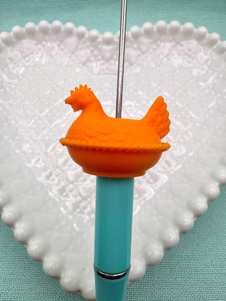 Orange hen on nest bead