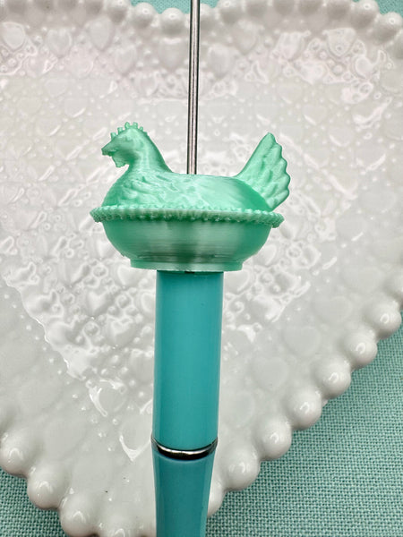 Silky jadeite green colored hen on nest bead