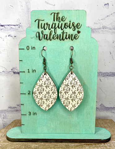 Cream colored wood Ho Ho Ho earrings