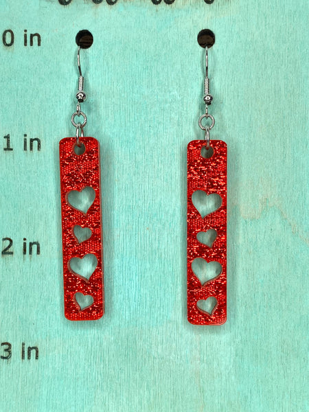 Red sparkle shimmer acrylic heart bar earrings